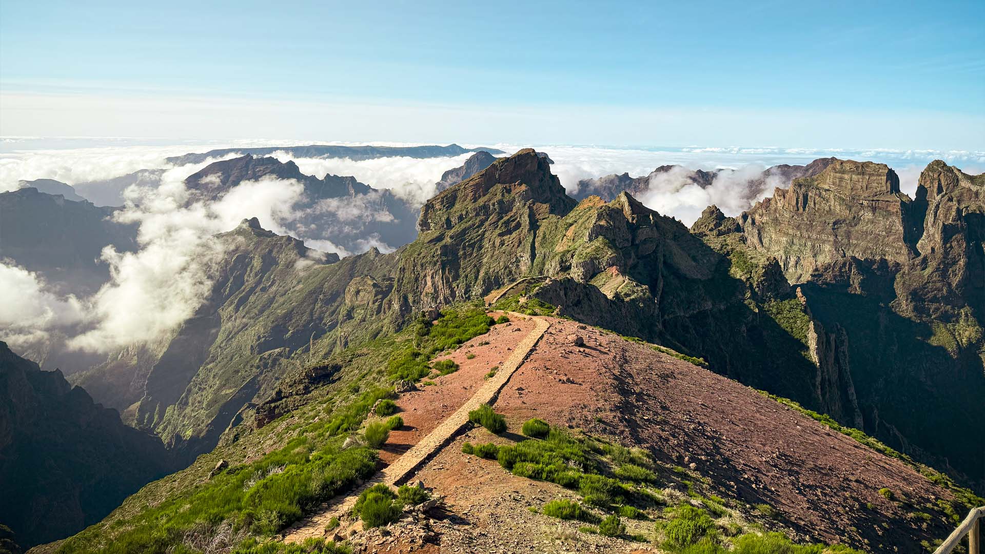 Pico do Arieiro 1818m sunrise above clouds sea pink golden light mountain peaks third highest Madeira East Portugal Atlantic