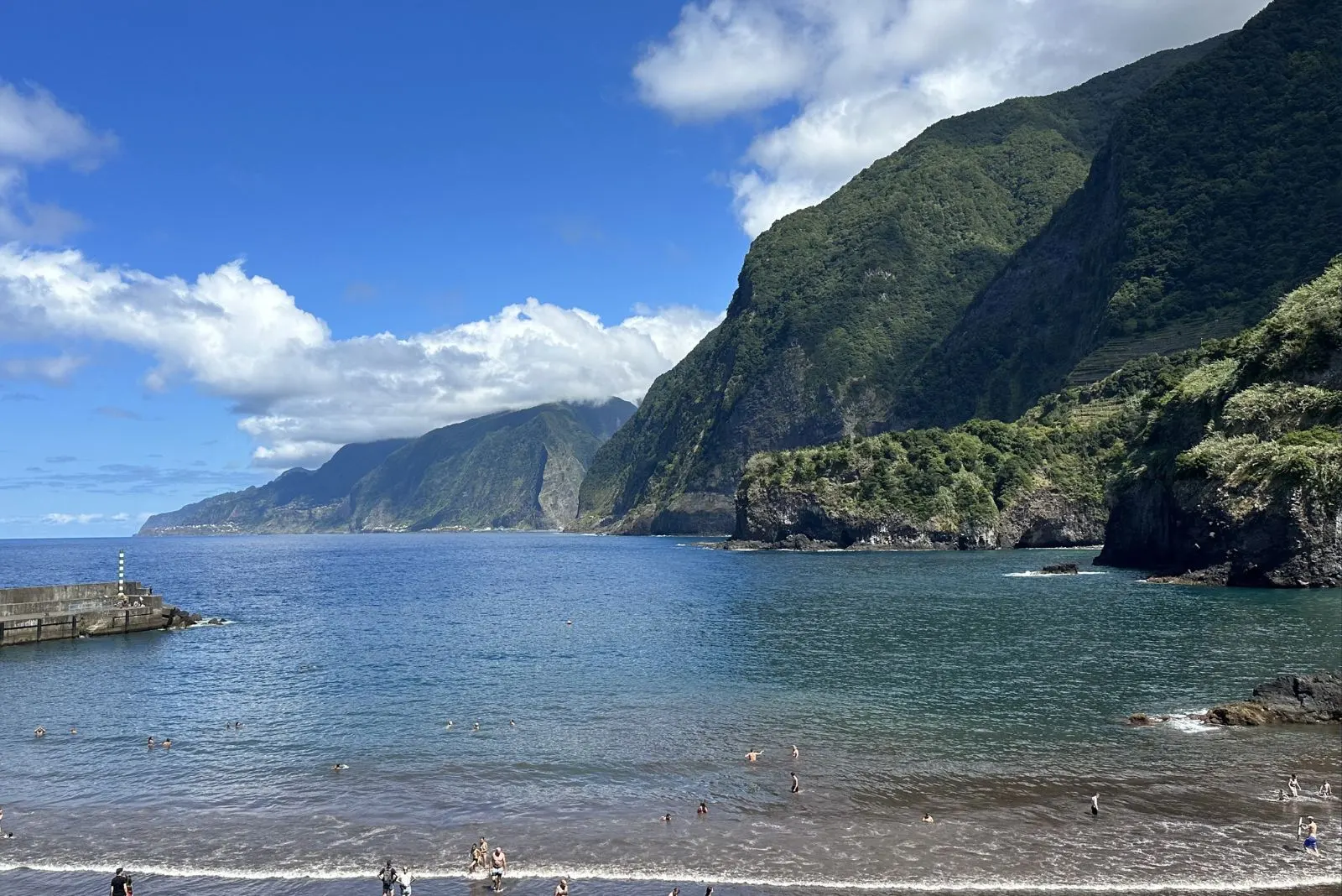 Seixal black volcanic sand beach north coast Madeira with basalt cliffs
